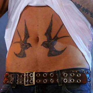 Robbie Willimas Tattoo two Swallows