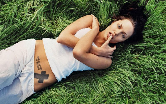 Angelina Jolie cross tattoo latin quote