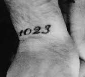 Robbie Williams 1023 tattoo