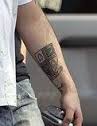 Robbie Williams burslem crest tattoo