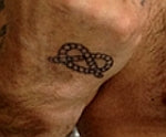 Robby Williams Stafford knot tattoo