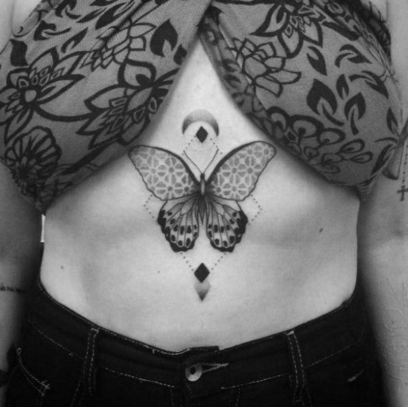 Blackwork butterfly sternum tattoo