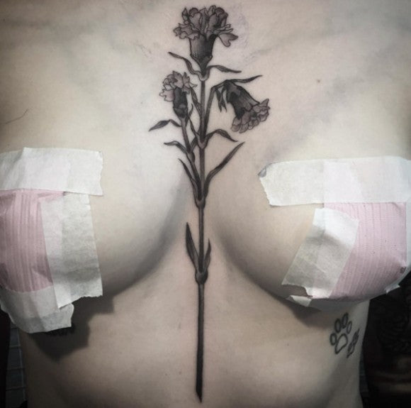 Wilting carnation sternum tattoo