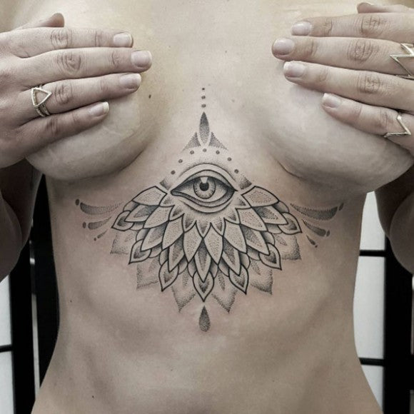 Dazzling dotwork eye sternum tattoo