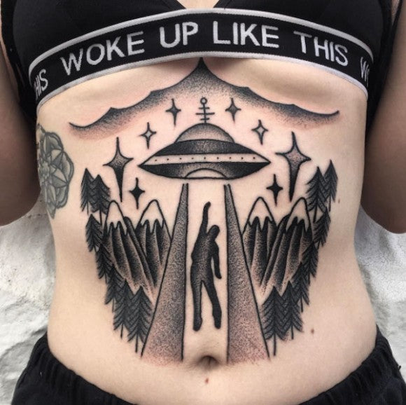 UFO sternum tattoo