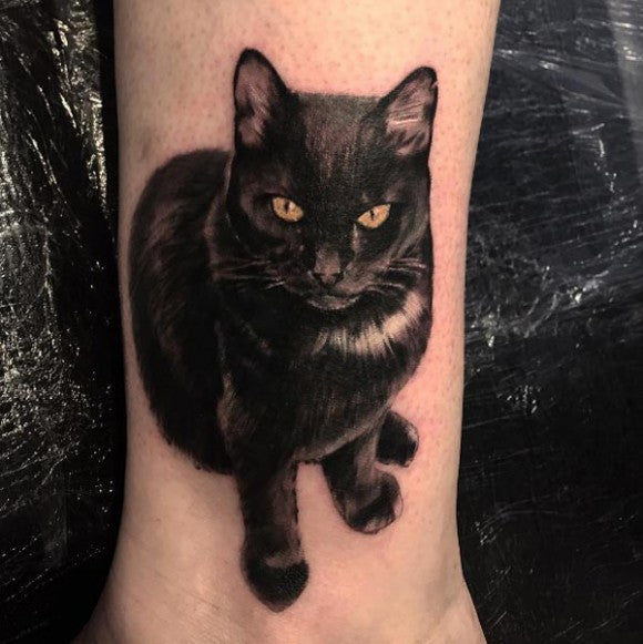 Hyper-realistic black cat tattoo by Paulo Lopes