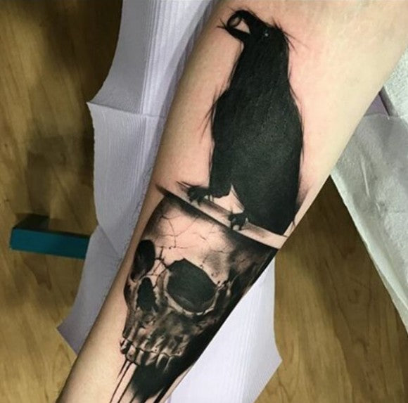 Sketched skull and crow tattoo by Hania Sobieski