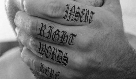 Small font tattoo on fingerq